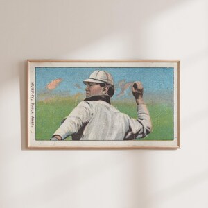 May include: Vintage baseball card featuring a baseball player in a white uniform and cap, throwing a ball. The card has a blue and green background with the text "MURPHY, Phila. Amer." printed on the left side.