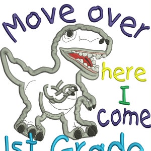 May include: A gray dinosaur with an open mouth and red tongue, embroidered on a white background. The text "Move over here I come 1st Grade" is embroidered in various colors, including blue, yellow, and green.