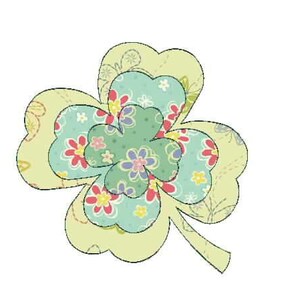 May include: A green four-leaf clover with a floral pattern. The clover is made of multiple layers of fabric with different floral designs in shades of pink, blue, green, and yellow.