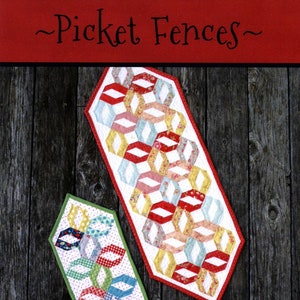 May include: Two quilted table runners with a picket fence design. The larger runner has a red border and features a pattern of red, white, and floral-patterned diamonds. The smaller runner has a green border and a similar design. The text "Picket Fences" and "This & That" are visible.
