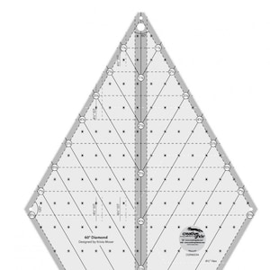 May include: A clear, diamond-shaped quilting ruler with a 60-degree angle design. The ruler features measurements in inches, dashed lines, and the text "60° Diamond" and "Designed by Krista Moser". The Creative Grids logo is visible.