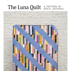 May include: The Luna Quilt pattern by Erica Jackman. A colorful quilt with a diagonal pattern of strips in shades of blue, pink, yellow, orange, and black. The quilt is made with jelly roll or fat quarter fabric. The quilt is available in baby, lap, twin, and queen sizes.