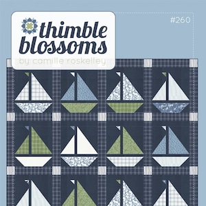 May include: A quilt pattern featuring a repeating sailboat design. The sailboats have white, blue, and green sails and are set against a navy blue plaid background. The text "thimble blossoms" and "SAIL" are also visible.