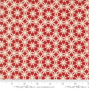 May include: Red and cream-colored fabric with a geometric pattern of diamonds, circles, and star shapes. The fabric has a repeating design, with a ruler along the bottom edge. The word "moda" is printed at the bottom.