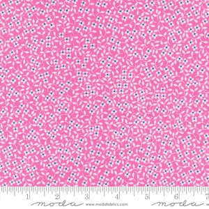 May include: A vibrant pink fabric covered in a delicate floral pattern. Tiny white flowers with blue centers are scattered across the surface, connected by thin, winding white stems. The fabric has a ruler along the bottom with the word "moda" printed on it.