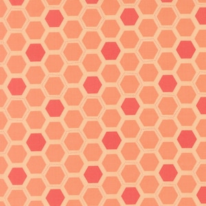 May include: A fabric with a repeating honeycomb pattern in shades of peach, coral, and light orange. The hexagonal shapes are outlined with a dotted line, creating a textured effect. The overall design is a warm and inviting pattern.