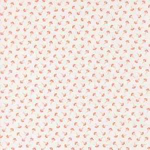May include: A white fabric featuring a repeating pattern of small, orange, five-petaled flowers. Each flower is connected to a short, dotted stem, creating a consistent, evenly spaced design across the entire surface of the textile material.