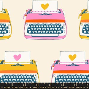 May include: A repeating pattern featuring colorful typewriters in shades of pink, orange, and yellow. Each typewriter has a sheet of paper with a heart shape. The text "RUBY STAR SOCIETY" is at the bottom.