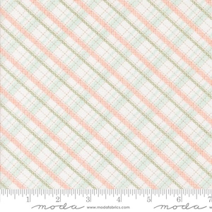 May include: A fabric swatch featuring a diagonal plaid pattern in shades of white, peach, and green. The design includes parallel stripes and a grid of dashed lines, creating a textured appearance. The fabric is measured in inches.