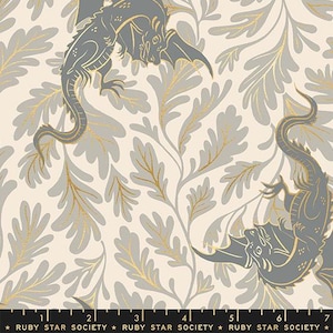 May include: A fabric print featuring grey dragons with gold outlines set against a cream background with grey leafy foliage. A black ruler at the bottom shows measurements from 1 to 7 inches, with the text Ruby Star Society repeated.