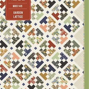 May include: A quilt pattern called "Garden Lattice" by Moda Fabrics. The pattern features a white background with a lattice design made up of squares in various colors and patterns, including green, blue, red, and yellow.