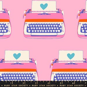 May include: A repeating pattern featuring pink and orange typewriters with blue keyboards and a sheet of paper with a teal heart. The background is a solid pink color. The text "RUBY STAR SOCIETY" is at the bottom.