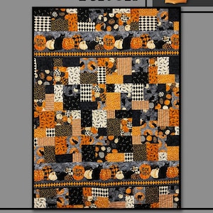 May include: A quilt pattern featuring a patchwork design with black, orange, and white fabric. The quilt is decorated with pumpkins, bats, and the words "Trick Treat". The title of the pattern is "Pumpkin Patch" and the designer is "Villa Rosa Designs".