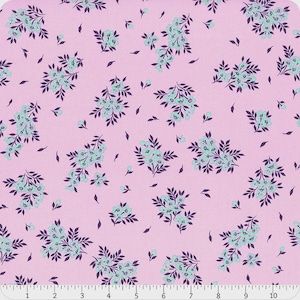 May include: A light pink fabric with a repeating floral pattern. Clusters of light blue flowers with dark purple leaves and stems are scattered across the surface. Small purple leaf shapes are also dispersed throughout the design.