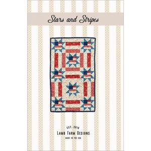 May include: A rectangular quilt pattern with a patriotic theme. The quilt features a design of red and white stripes, blue stars, and rectangular blocks. The text "Stars and Stripes" is at the top, with "Lamb Farm Designs" and "Made in the USA" at the bottom.