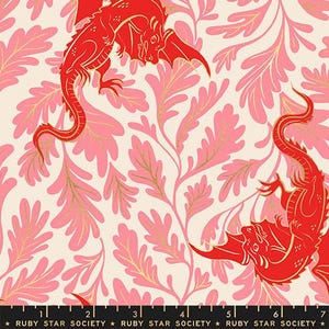May include: A fabric print featuring bright red dragons with gold accents set against a cream background with pink leafy foliage. A black selvage edge at the bottom displays the text Ruby Star Society and a ruler measuring 7 inches.