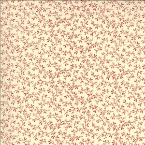 May include: Cream-colored fabric with a repeating pattern of red, twig-like branches and small, oblong shapes. The design creates a dense, all-over floral or botanical motif, suitable for quilting or crafting projects.