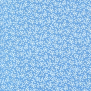 May include: A seamless pattern of light blue fabric with a delicate floral design. The pattern features small, white flowers and leaves arranged in a repeating, all-over print. The fabric has a subtle texture.