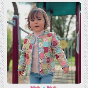 May include: A patchwork children's jacket with the text "TIC TAC TOE CHILDREN'S PATCHWORK JACKET". The jacket features a variety of colorful fabric squares in pink, green, and blue. The jacket is buttoned up and has a light blue trim. The brand "m&m MELLEY AND ME" is also visible.