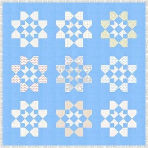 May include: Nine blue and white star-shaped quilt blocks with different patterns in the center. The blocks are arranged in a 3x3 grid on a light blue background.