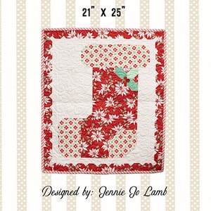 May include: A red and green Christmas stocking quilt pattern with a white background. The stocking is 21 inches by 25 inches. The pattern is designed by Jennie Jo Lamb and is called "Holly Jolly Stocking".