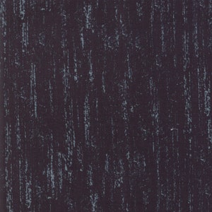 May include: A dark brown fabric with a light blue textured pattern. The fabric has a subtle sheen and a slightly rough texture.