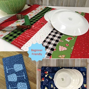 May include: A sewing pattern titled Dry Ideas by Poorhouse Quilt Designs for rectangular dish drying mats. The pattern displays holiday-themed fabric with gingerbread men, red and green stripes, and a blue version with wine glass motifs.