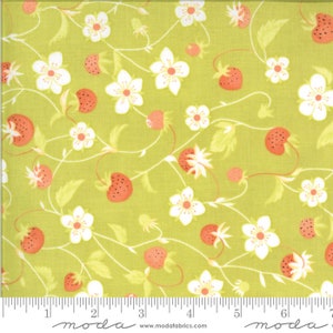 May include: Lime green fabric with a repeating pattern of strawberries and white flowers. The strawberries are red with small seeds, and the flowers have yellow centers. The fabric has a delicate, whimsical feel, suitable for quilting or crafting projects.