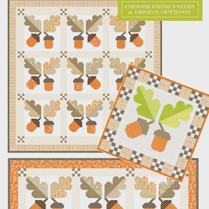 May include: A quilt with an acorn and oak leaf pattern in shades of orange, tan, and brown. The quilt features the text "Agatha's Oaks" and "Choose from 3 sizes & design options!" The design includes a smaller, square quilt.