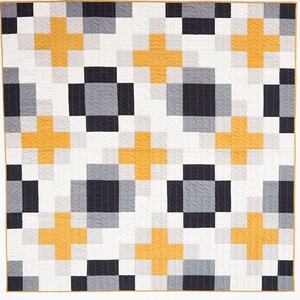 May include: A square quilt featuring a geometric pattern of repeating plus signs and solid blocks. The design incorporates a color palette of mustard yellow, charcoal gray, light gray, and white, finished with a thin mustard yellow border.