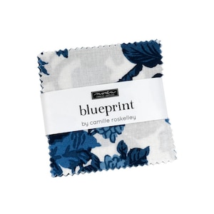 May include: A stack of fabric squares with a floral pattern in shades of blue and white. The fabric is wrapped with a white band that reads "blueprint by camille roskelley". The fabric is from Moda Fabrics.