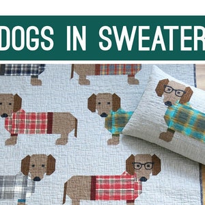 May include: A quilt featuring a pattern of brown dachshunds wearing plaid sweaters. The quilt is made of a light gray fabric with a subtle texture. The dachshunds are arranged in a repeating pattern, with some wearing glasses. The quilt is accompanied by a matching pillow with a dachshund wearing glasses and a plaid sweater.
