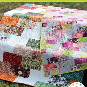 May include: A quilt featuring a Side Braid pattern with rectangular fabric patches in various floral and geometric prints. The quilt displays a mix of orange, pink, green, purple, and white colors with a lime green border. Text reads Side Braid #104.