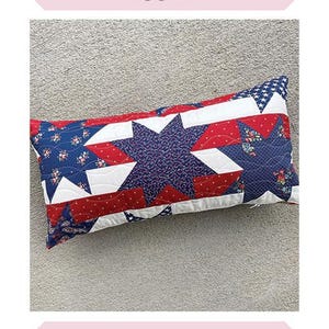 May include: A red, white, and blue patchwork pillow with stars and stripes. The pillow is 12 inches by 24 inches. It is made by Sew Lux Fabric.