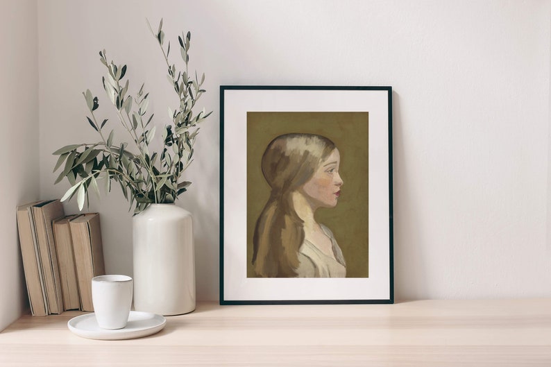 May include: A framed painting of a woman with long brown hair, wearing a white dress, against a muted green background.