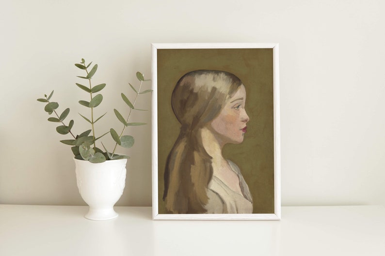 May include: A framed painting of a woman with long brown hair, wearing a white dress, against a green background.