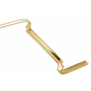 May include: A gold-colored metal binder clip with a curved design.