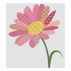 May include: A pink and yellow patchwork flower with a green stem and leaves. The flower is made up of different patterns and textures.