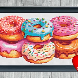 May include: A stack of six colorful donuts with various toppings, including sprinkles, chocolate, and frosting. The donuts are arranged in a circle on a white background.