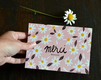 Daisy poscard with french message : "merci BEAUCOUP" flowers card saying thank you very much in french on pink background.