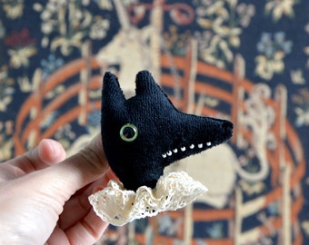 Wolf brooch - black velvet and lovely lace collar .
