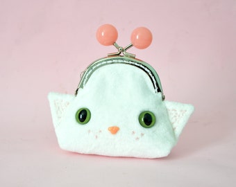 Click-clack coin purse in the shape of a white cat - velvet and pink flower lining.