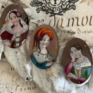 May include: A set of three ceramic mugs with a speckled, matte finish. The mugs are in shades of cream, light gray, and dark gray. Each mug has a simple, minimalist design, perfect for coffee or tea.