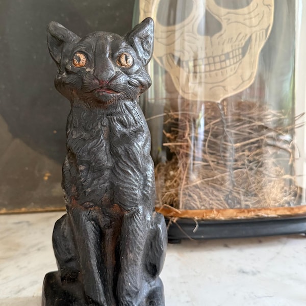 antique black cat cast iron doorstop, circa 1920s