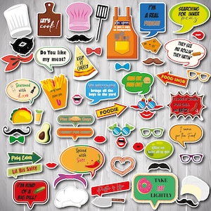 May include: A set of 24 colorful photo booth props with various food-themed designs. The props include speech bubbles with funny sayings, hats, glasses, mustaches, and other accessories. Some of the sayings include "Let's cook!" "Do you like my meat?" "Keep it cheesy" "I'm a real fungi" "Searching for inner peas" "Food snob" "I love it when you call me big!" "I came for the food" "Take me lightly".