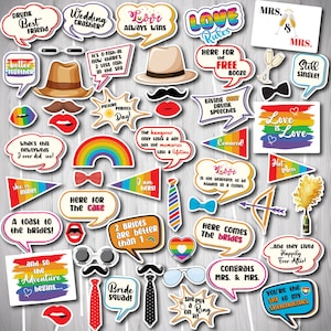 May include: A set of 25 printable photo booth props for a wedding or engagement party. The props feature rainbow colors, hearts, and text related to love, marriage, and celebrations.  The props include speech bubbles, mustaches, glasses, bow ties, and more.