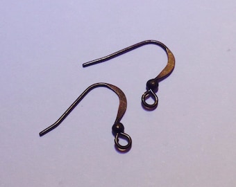 May include: Two bronze earring hooks with a small ball at the top of each hook.