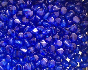 150 St. Transparent sapphire blue pinch-bead 4 x 3 mm