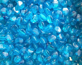 Pack of 150 transparent light blue glass pinch beads 4 x 3 mm