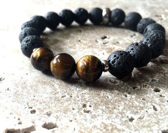 Tigerauge Armband mit schwarzen Lava Stein Perlen. Maskulines grobstrick Perlenarmband mit Akzenten aus Edelstahl.